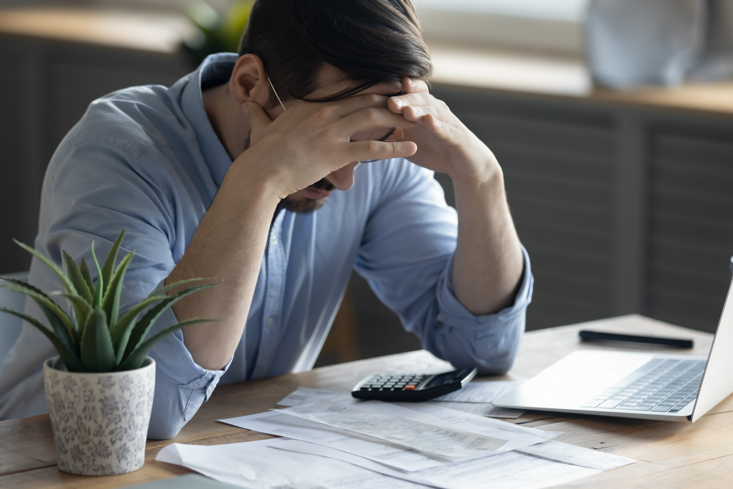 Frustrated man on laptop